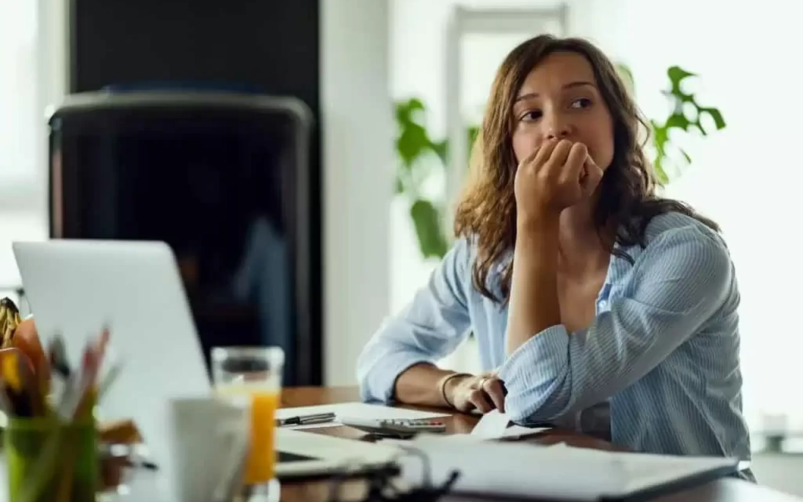 Young worried woman thinking something while calculating her home budget 1024x683
